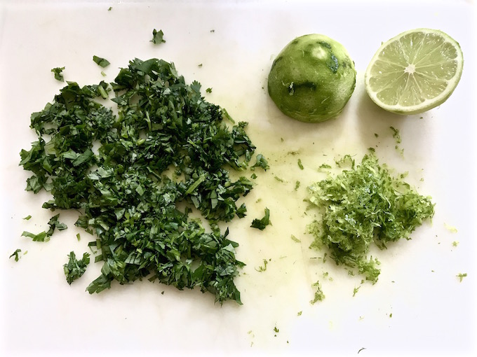 Chopped cilantro, lime zest, and lime sliced in half.
