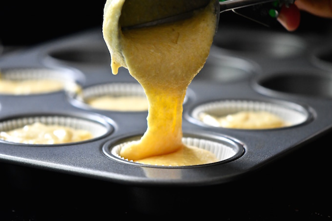 Muffin Method - Scooping batter into muffin tin.
