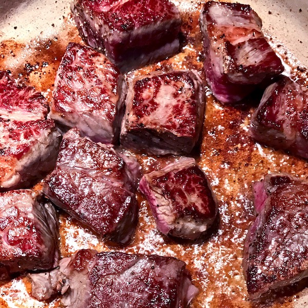 Seared stew meat in pot.