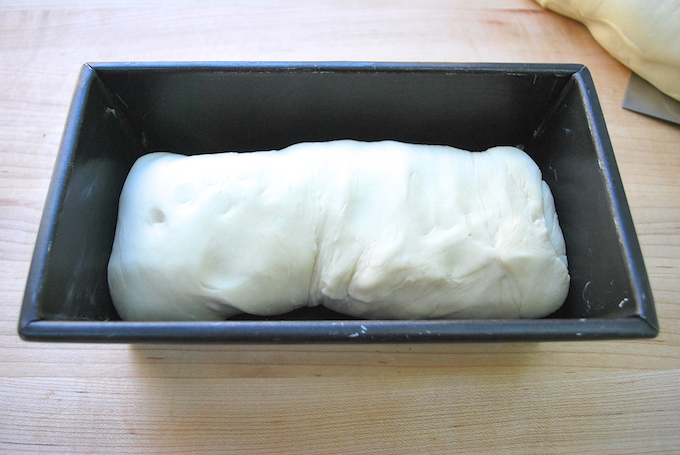 Bread dough placed in loaf pan.