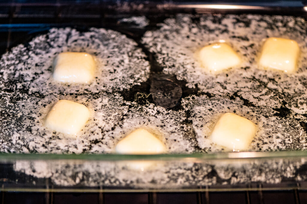 Butter melting in a pan in the oven.