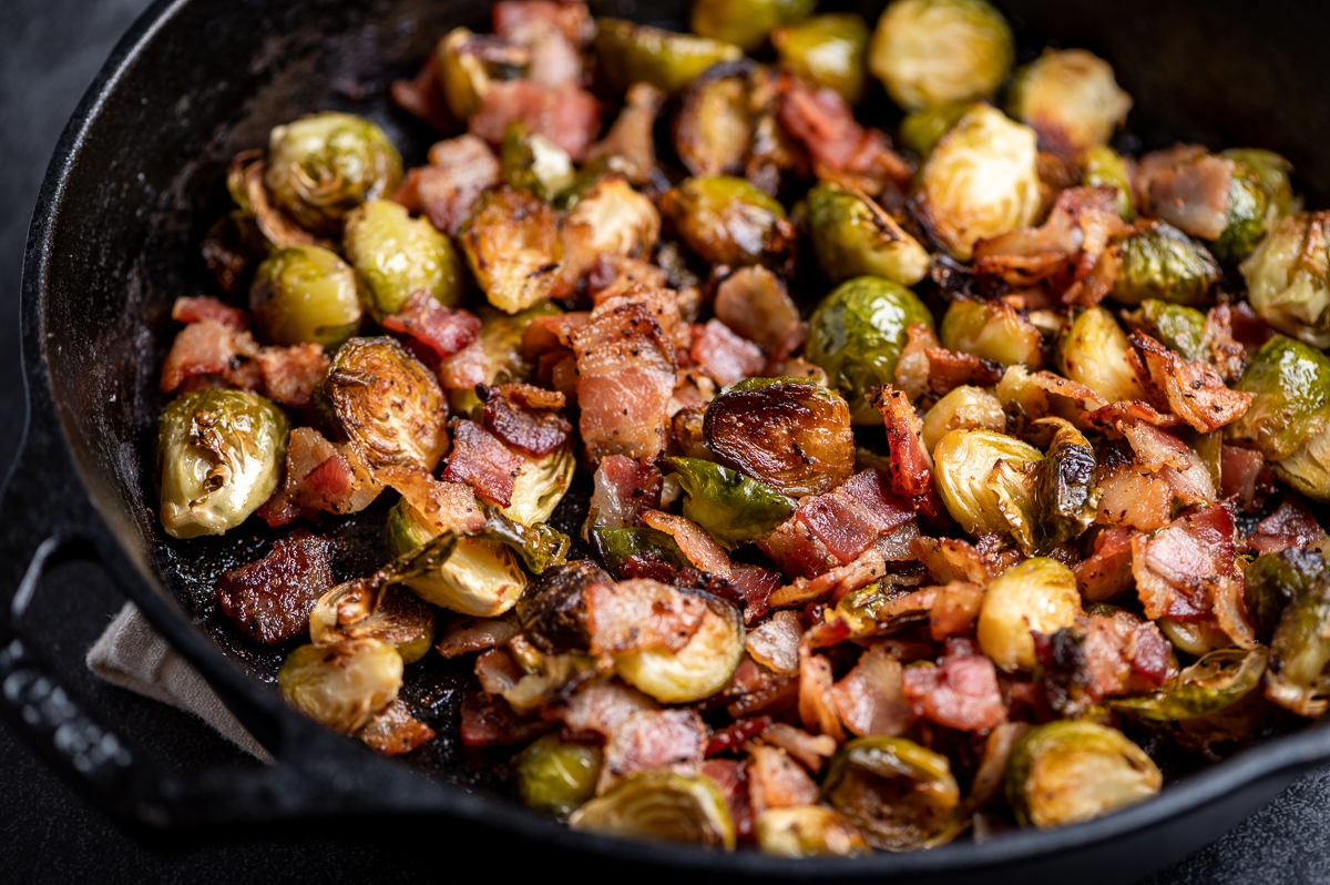 Brussels sprouts and bacon roasted in a cast iron skillet.