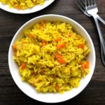 Perfect Rice Pilaf prepared two ways. A quick version flavored simply with dried spices requiring as much time as the boxed version. The second version is prepared with a mirepoix - diced onions, carrots, and celery - adding depth, flavor, and some texture. Both are delicious and simple to prepare.