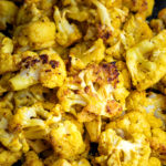 Cauliflower florets coated in curry spices and roasted.