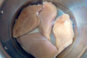Brining chicken breasts.