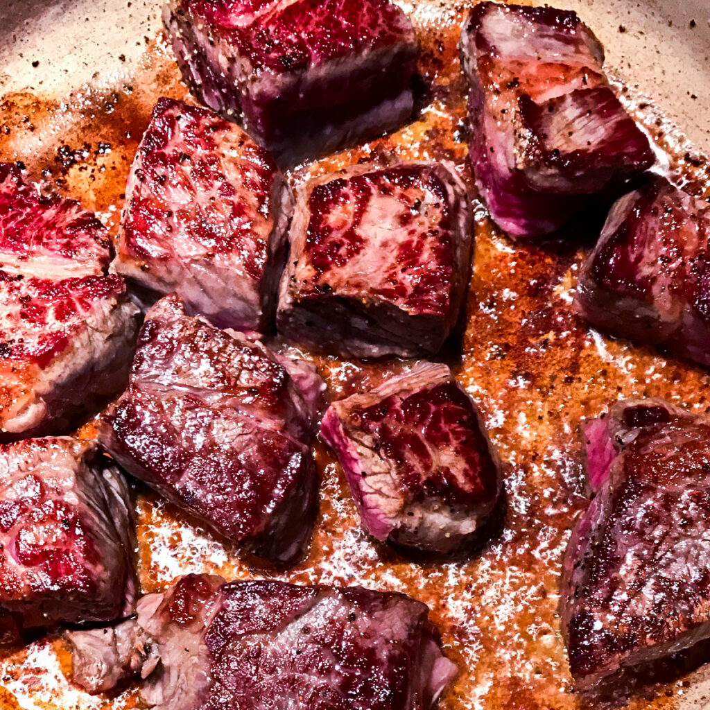 Chunks of seasoned stew beef.