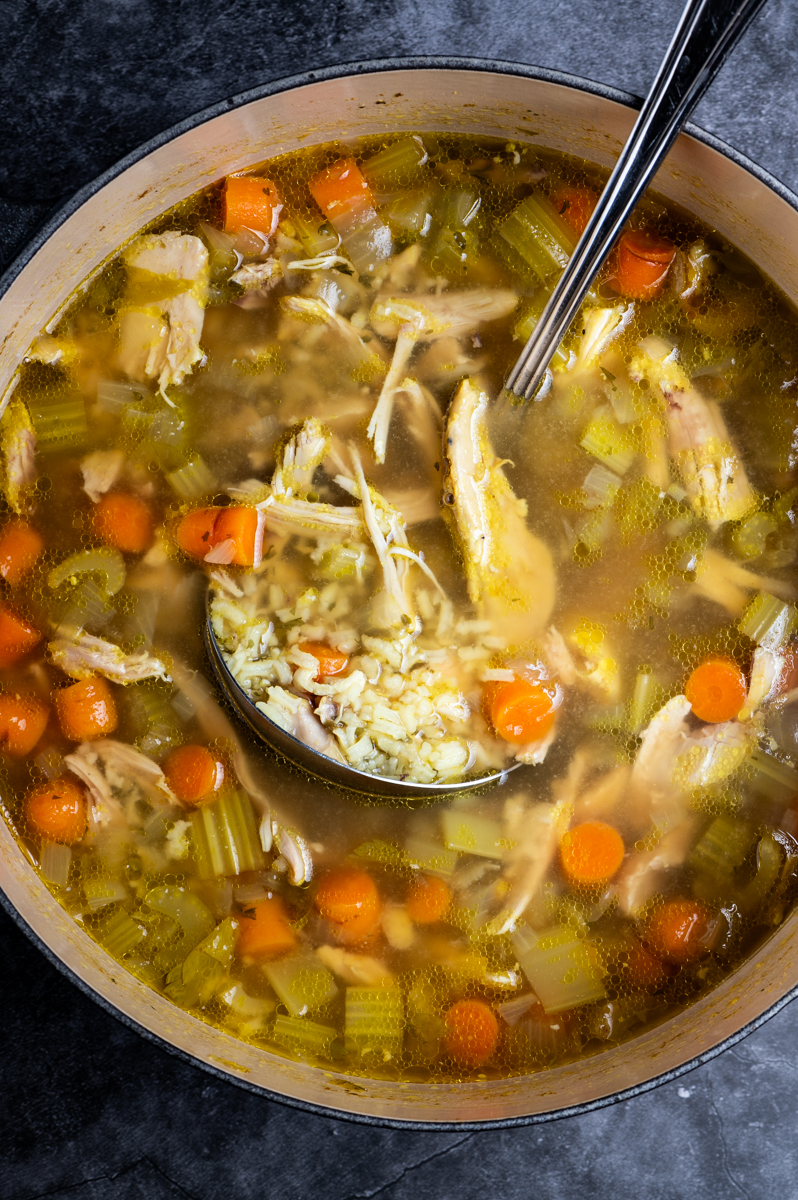 A pot of chicken and rice soup.