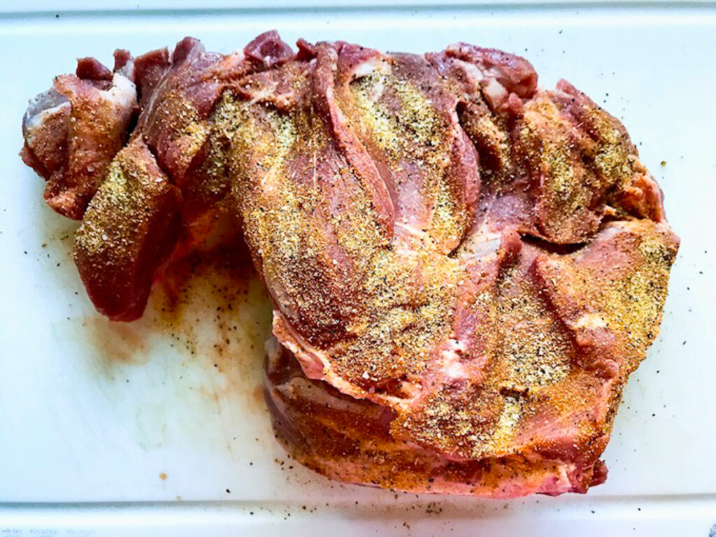 Seasoned the pork by unrolling it to get every crevice.