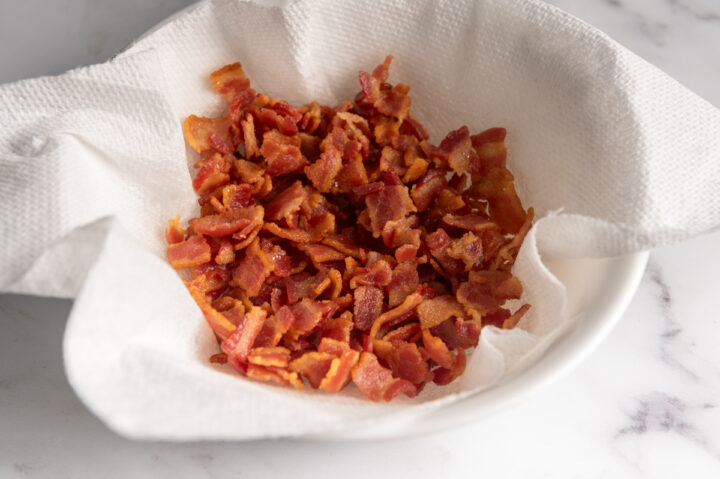 A bowl of crispy bacon bits.