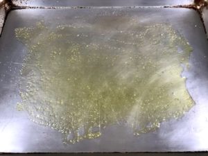 Olive oil and salt on a baking sheet.