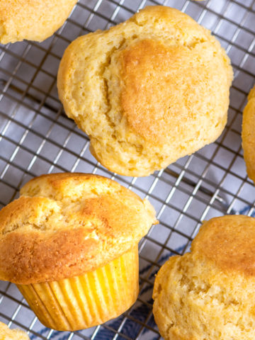 Corn muffins on a cooling rack.