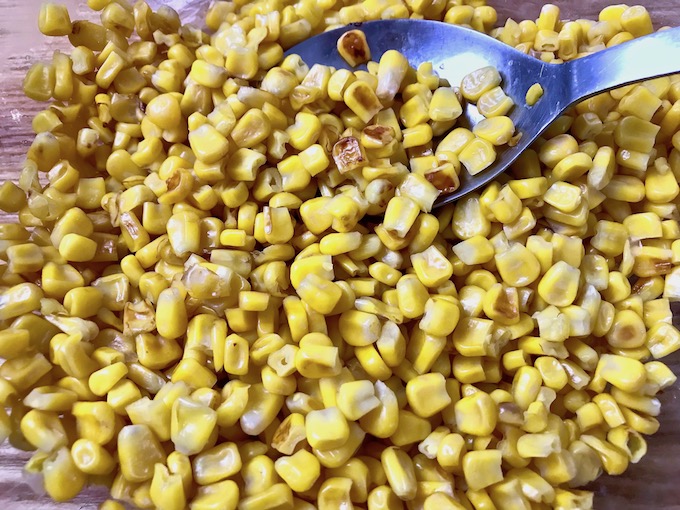 Roasted sweet corn in a bowl.
