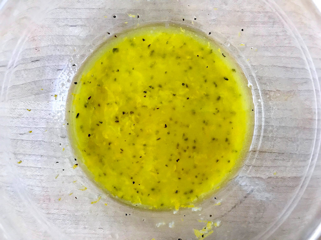 Fresh lemon dressing in a bowl.
