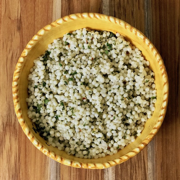 A bowl of lemon herb pearl couscous.