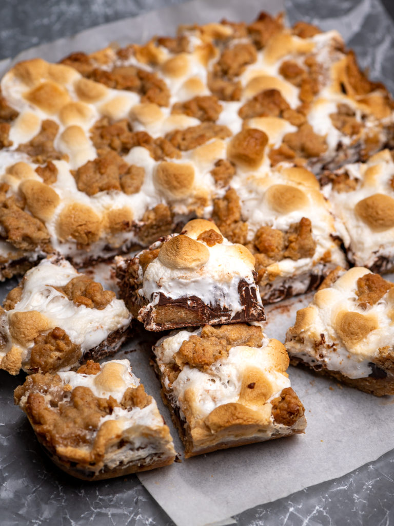 S'mores bars sliced on a board.