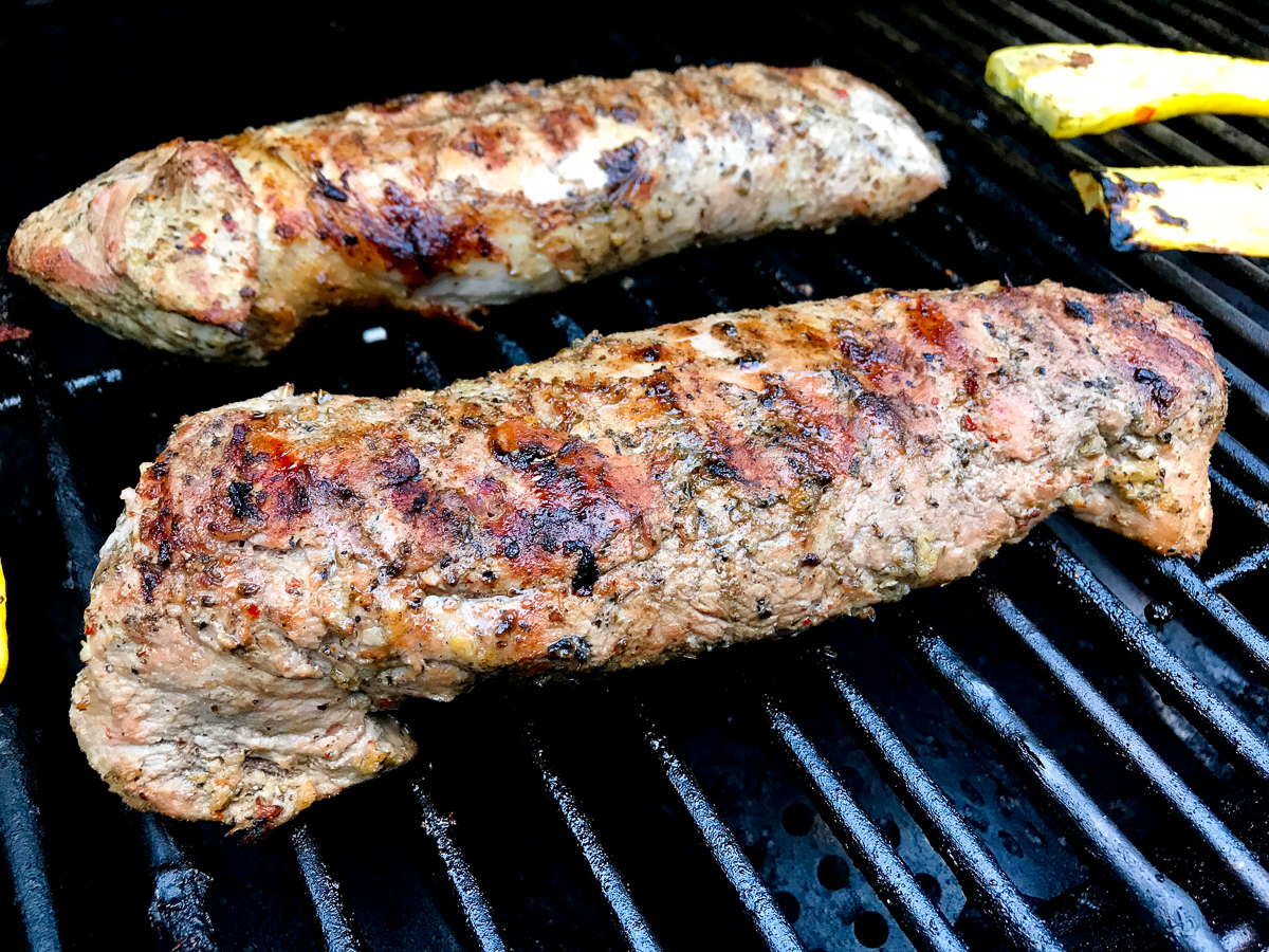 Pork tenderloins on a grill.