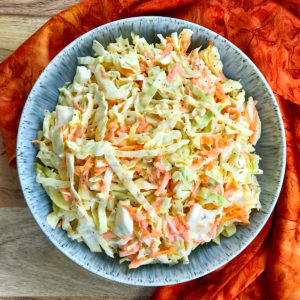 A bowl of creamy coleslaw.
