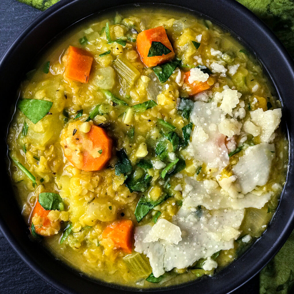 A bowl of lentil vegetable soup .