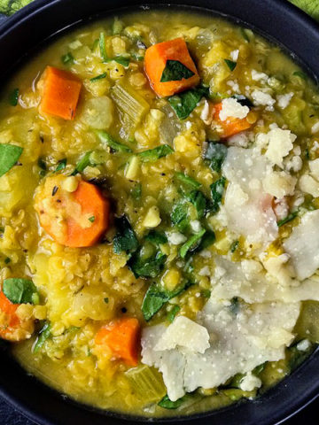 A bowl of lentil vegetable soup .