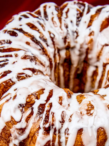 Icing drizzled on top of monkey bread.