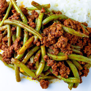 Closeup of ground beef with string beans.