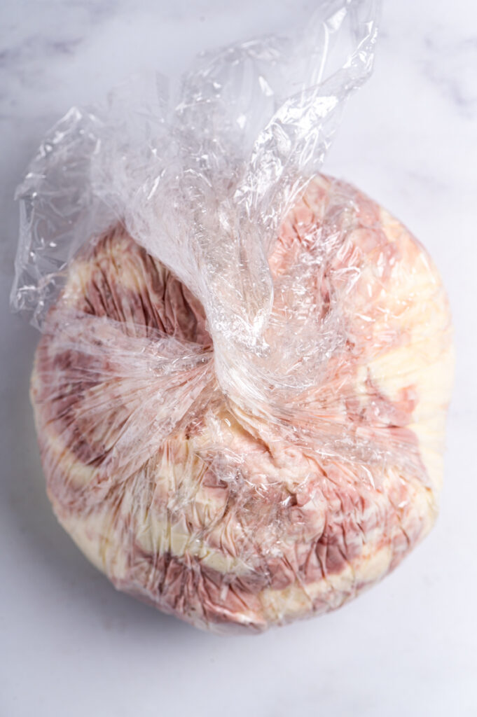 A blend of cheddar cheese and port wine cheese wrapped in plastic.