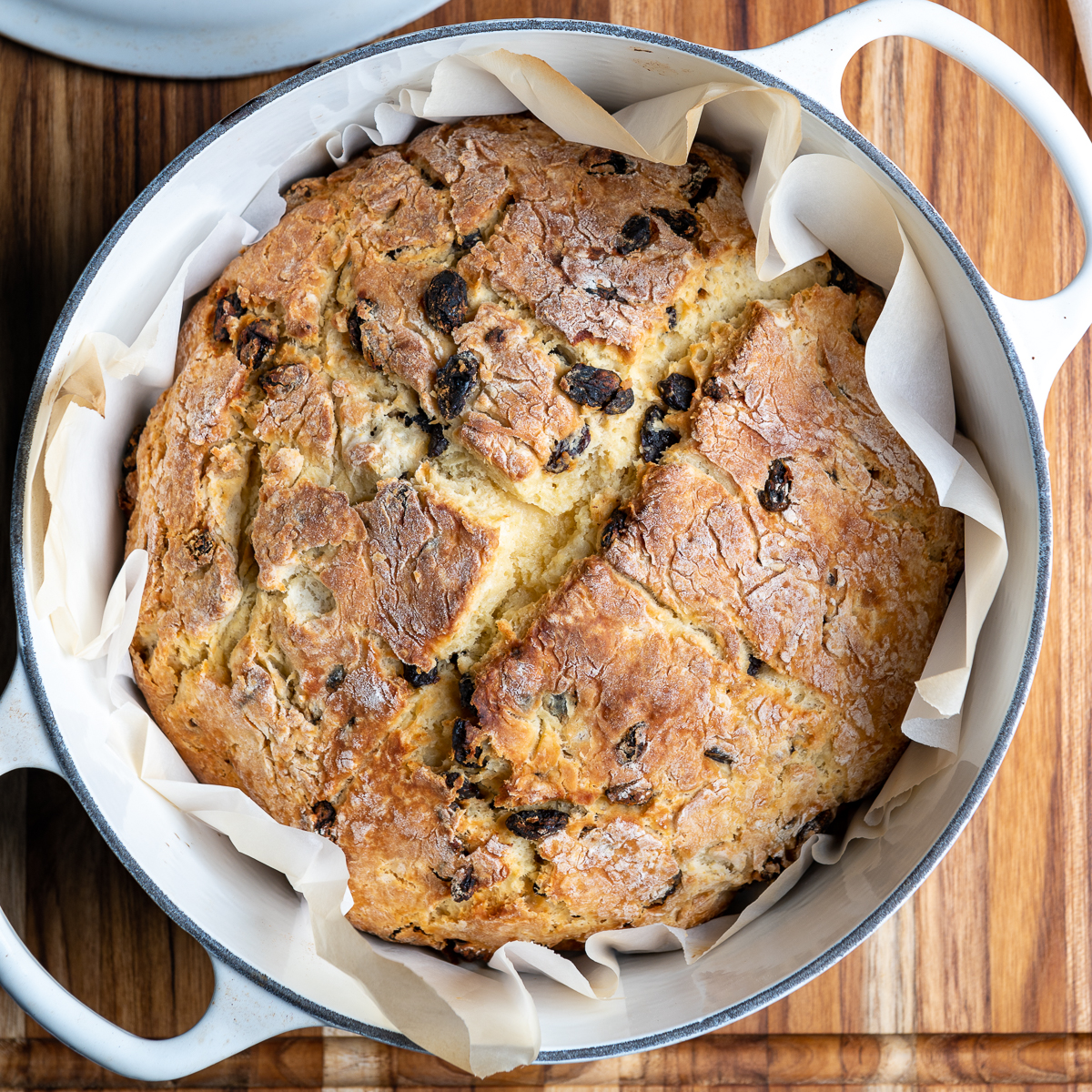 A loaf of Irish soda bread baked in a Dutch oven pot.