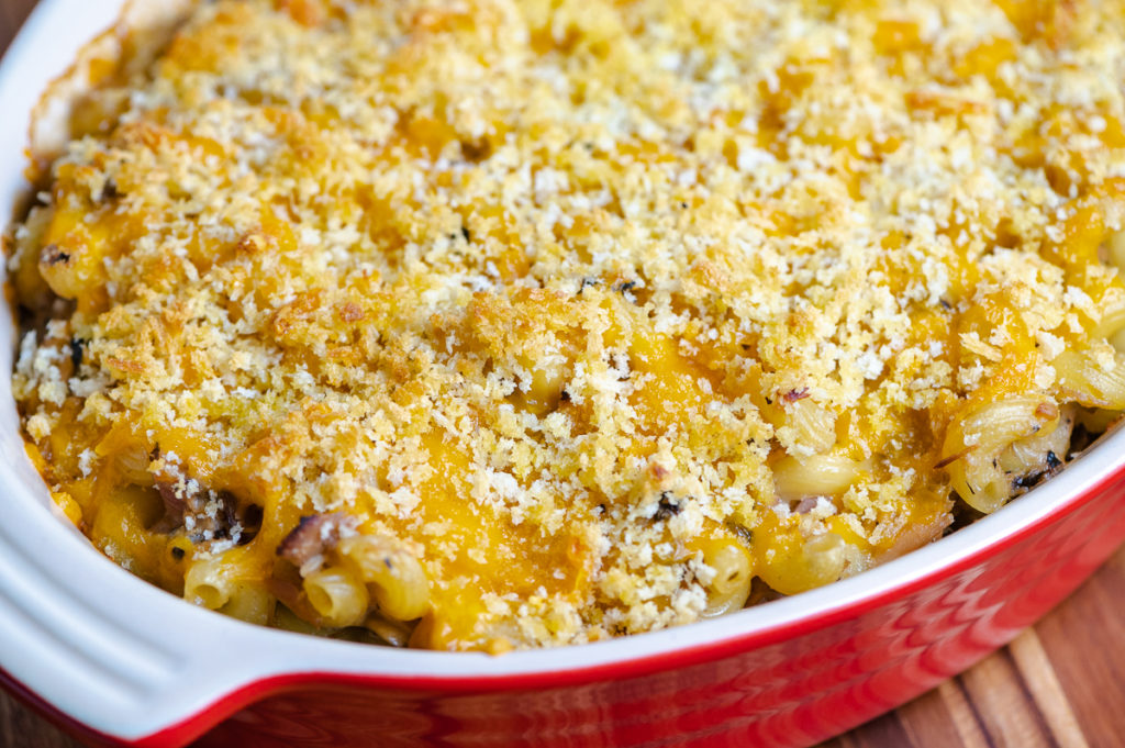 A casserole dish with a cheese and panko topping.
