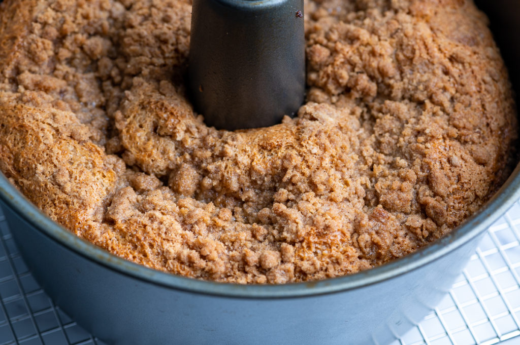 A baked cinnamon coffee cake cooling.