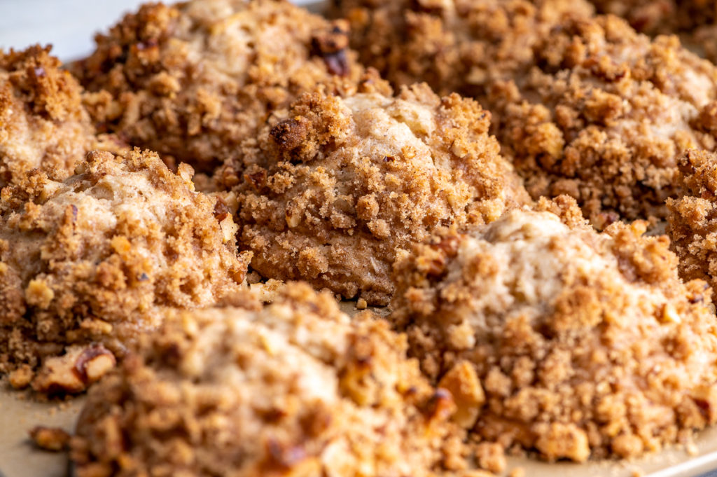 Tops of banana muffins covered in streusel.