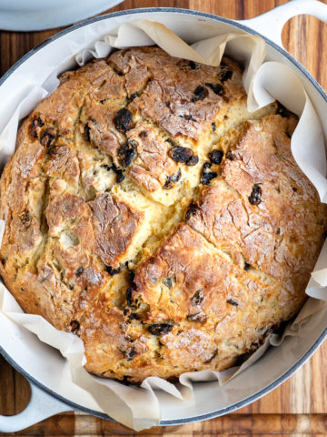 A loaf of Irish soda bread baked in a Dutch oven pot.