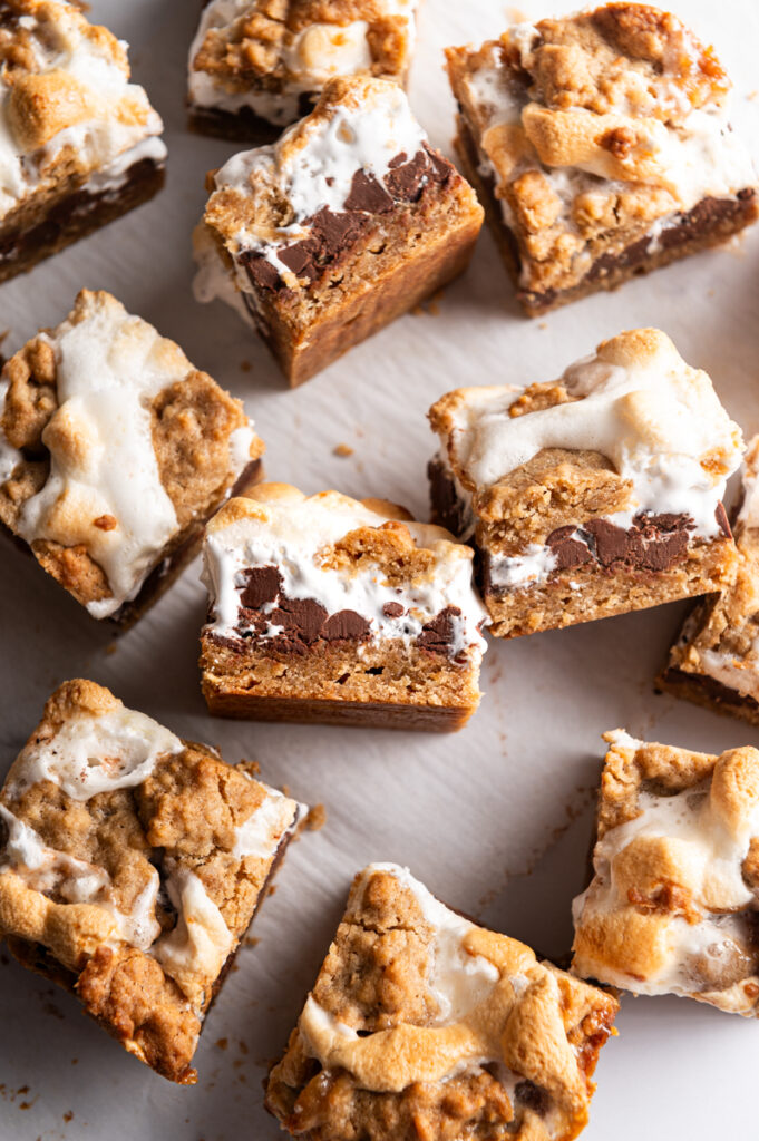 Sliced smores bars on parchment paper.