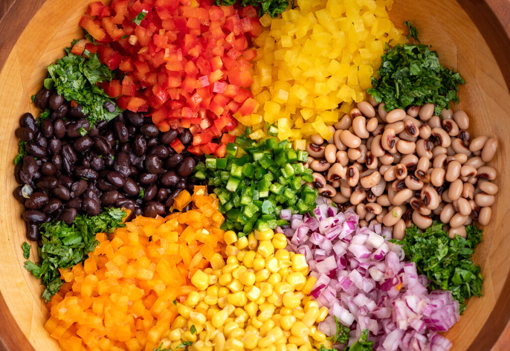 Diced vegetables laid out in a pattern in a bowl.
