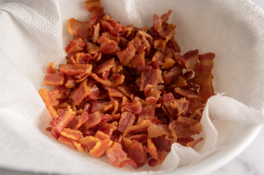 Crispy bacon bits in a bowl.