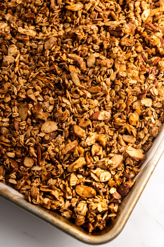 A baking sheet of baked salted cinnamon nut granola.