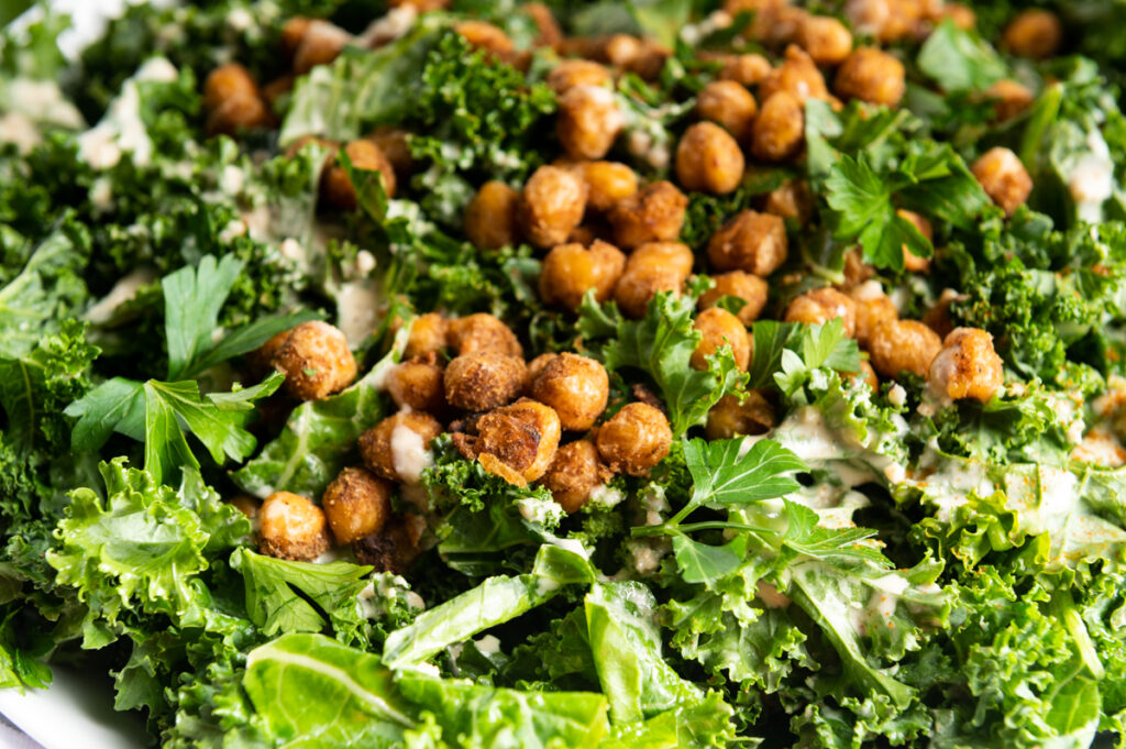 Chickpeas on top of torn kale.