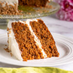 A slice of carrot cake on a plate.
