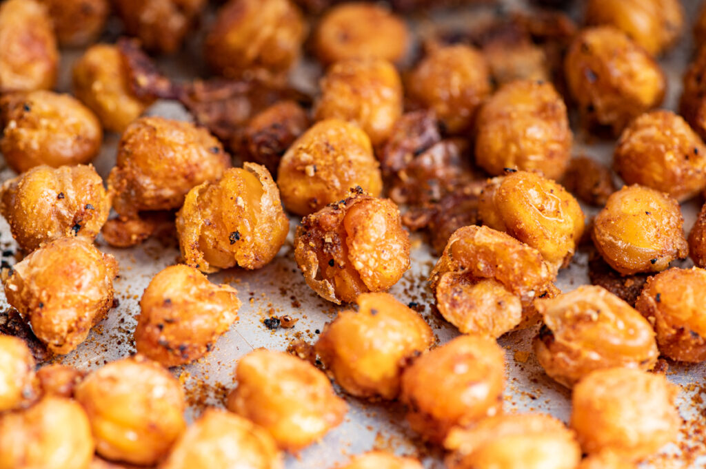 Roasted crispy crunchy chickpeas on a baking sheet.