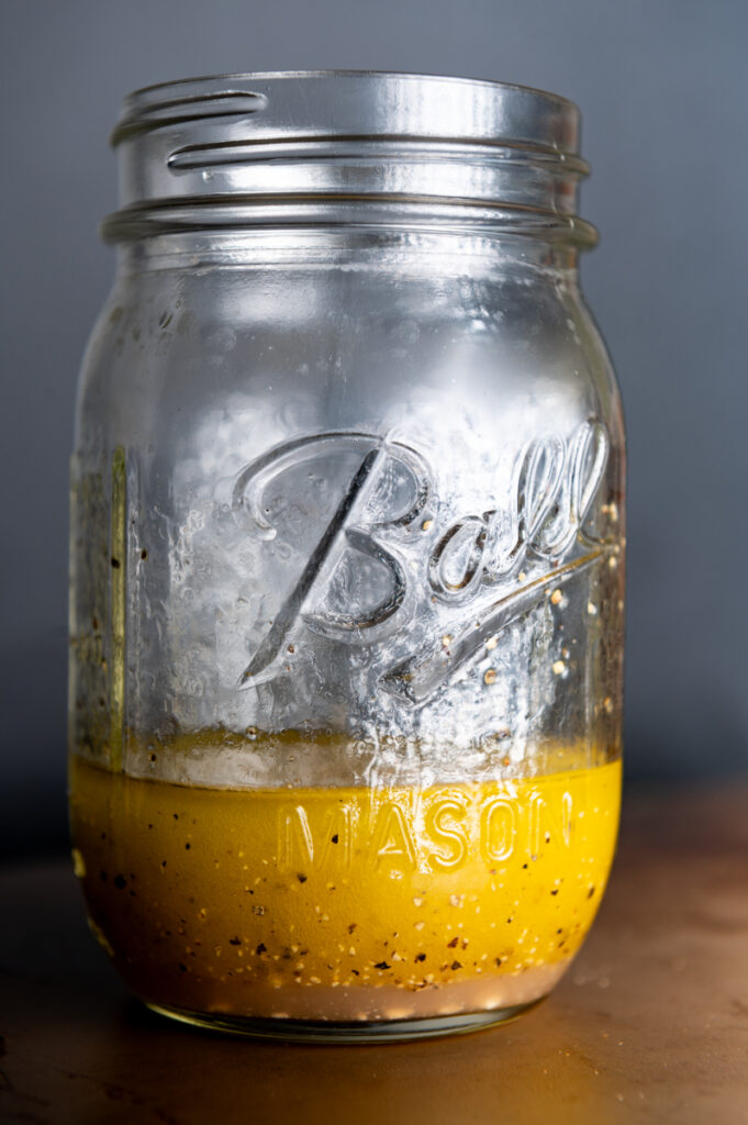 A jar of lemon vinaigrette.