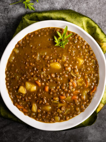 A white bowl of lentil soup.
