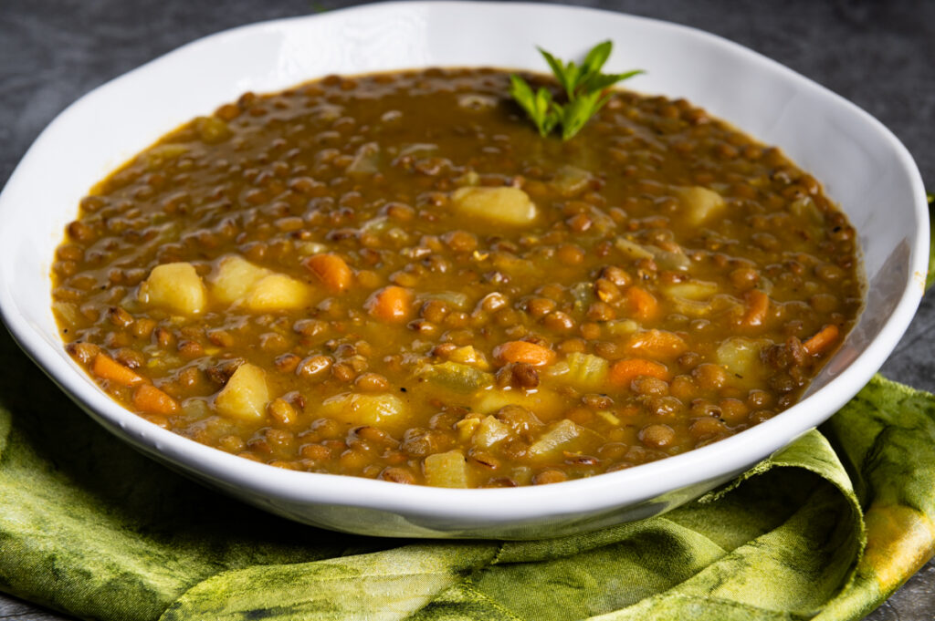A white bowl of lentil soup.